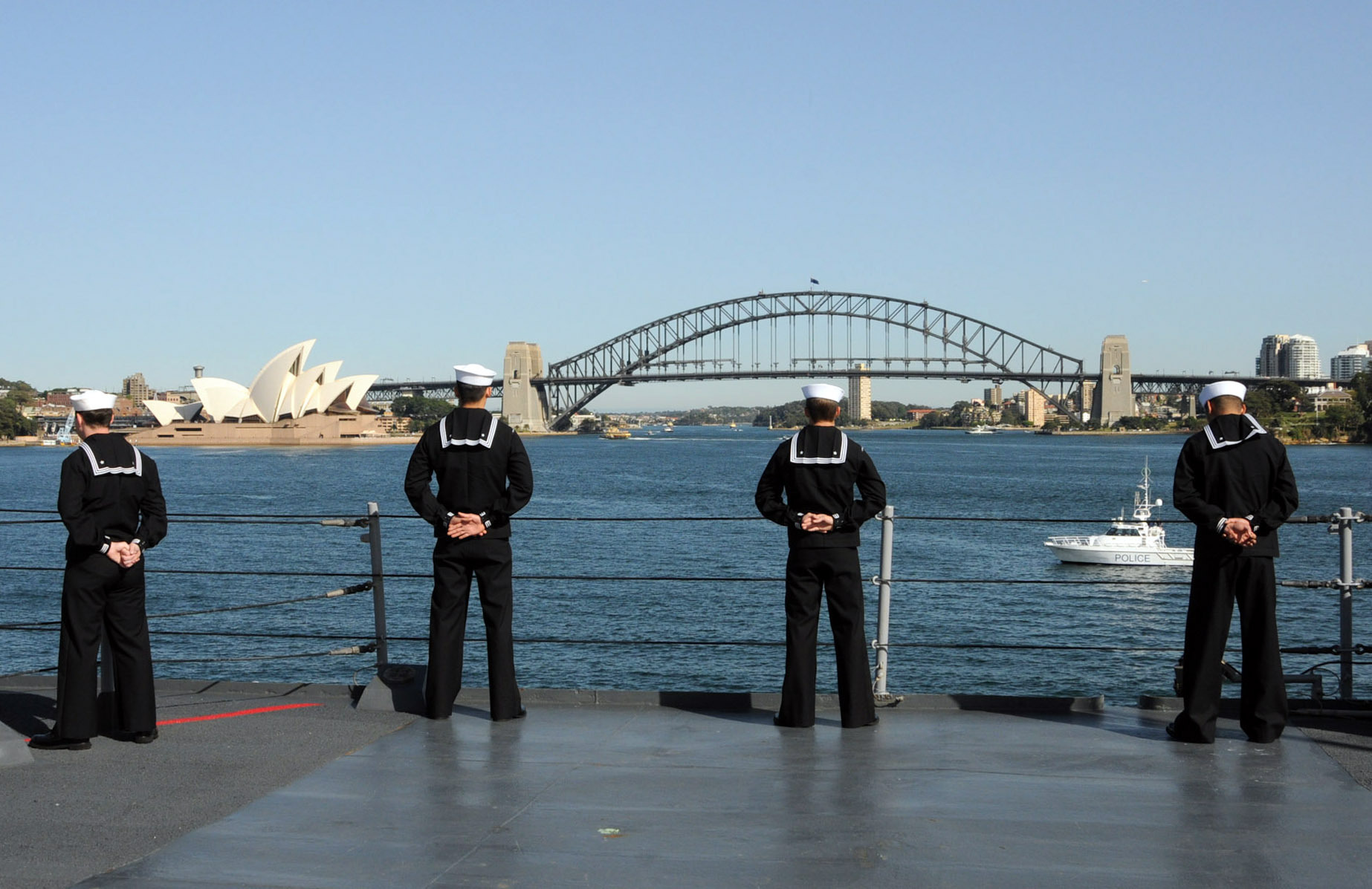 Sailors stand at parade rest near Sydney Opera House